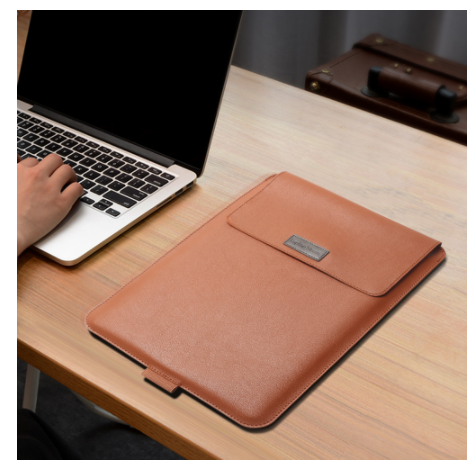 Leather-look laptop sleeve, brown, on a desk