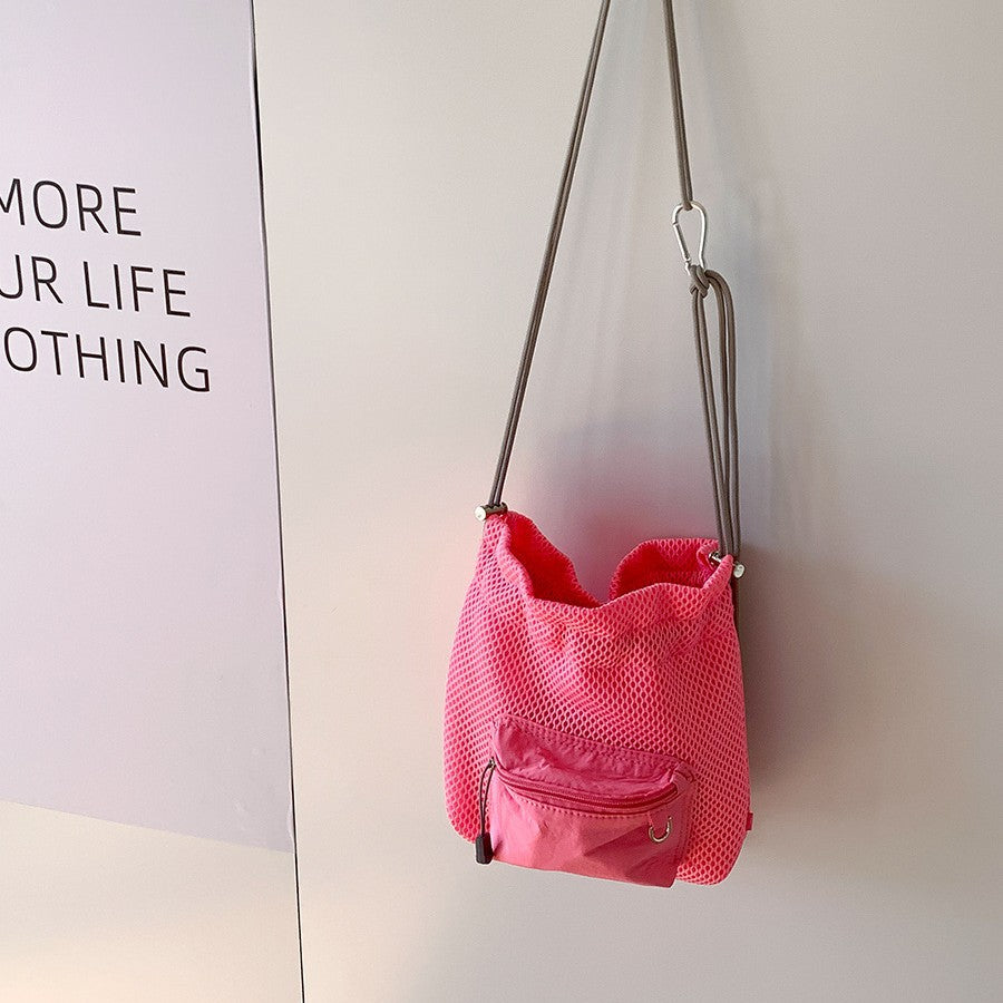 Mesh Drawstring Crossbody Bucket Bag, pink, hanging