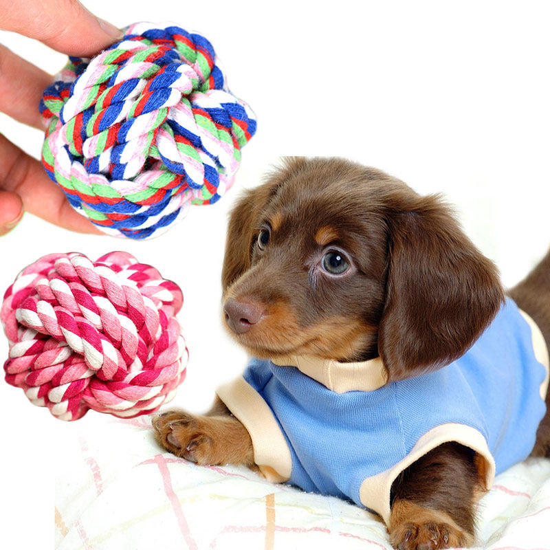 Braided cotton rope balls in blue, multicolour and pink with a puppy