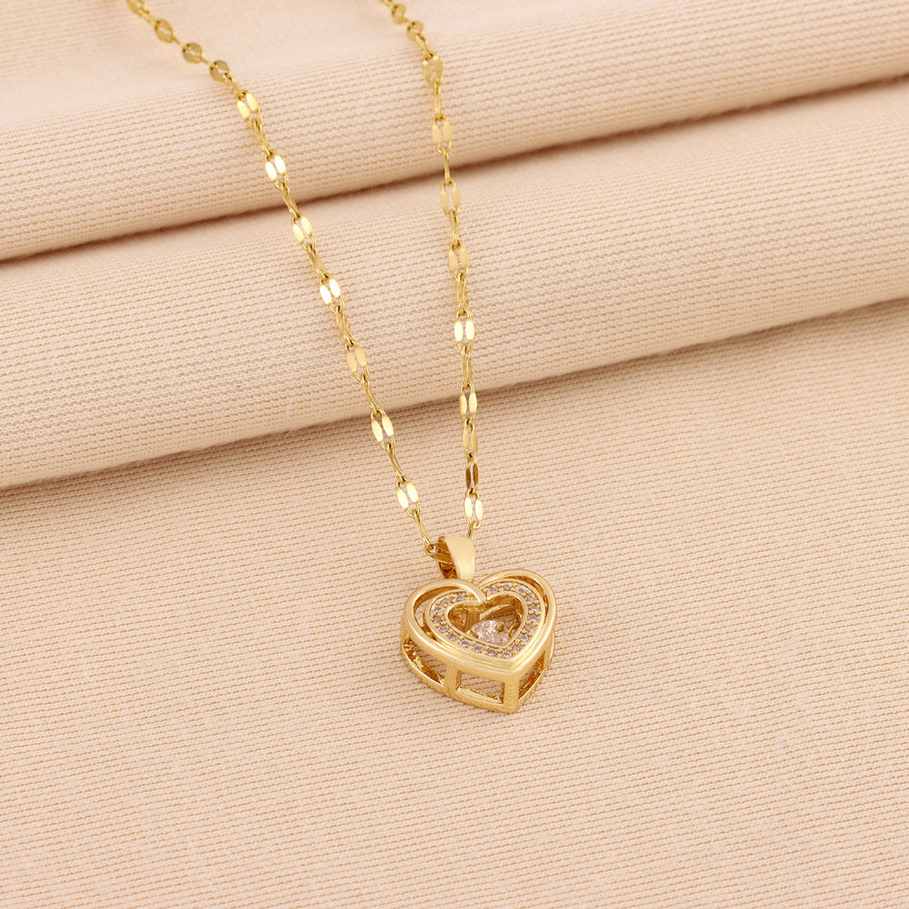 Rhinestone heart pendant necklace on fabric