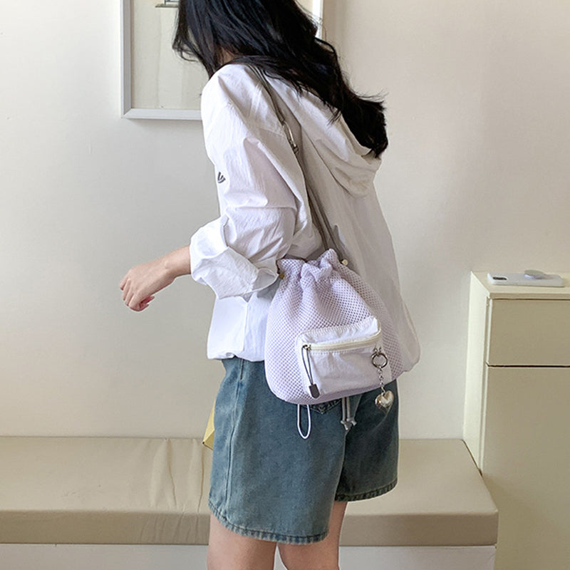 Mesh Drawstring Crossbody Bucket Bag, beige, worn crossbody